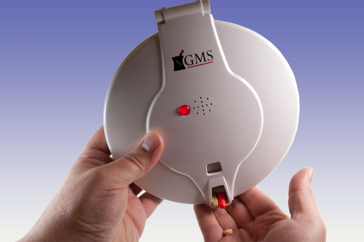 When the Med-e-lert alarm sounds, a light blinks and the unit must be picked up and medications dumped in hand to shut off the alarm.